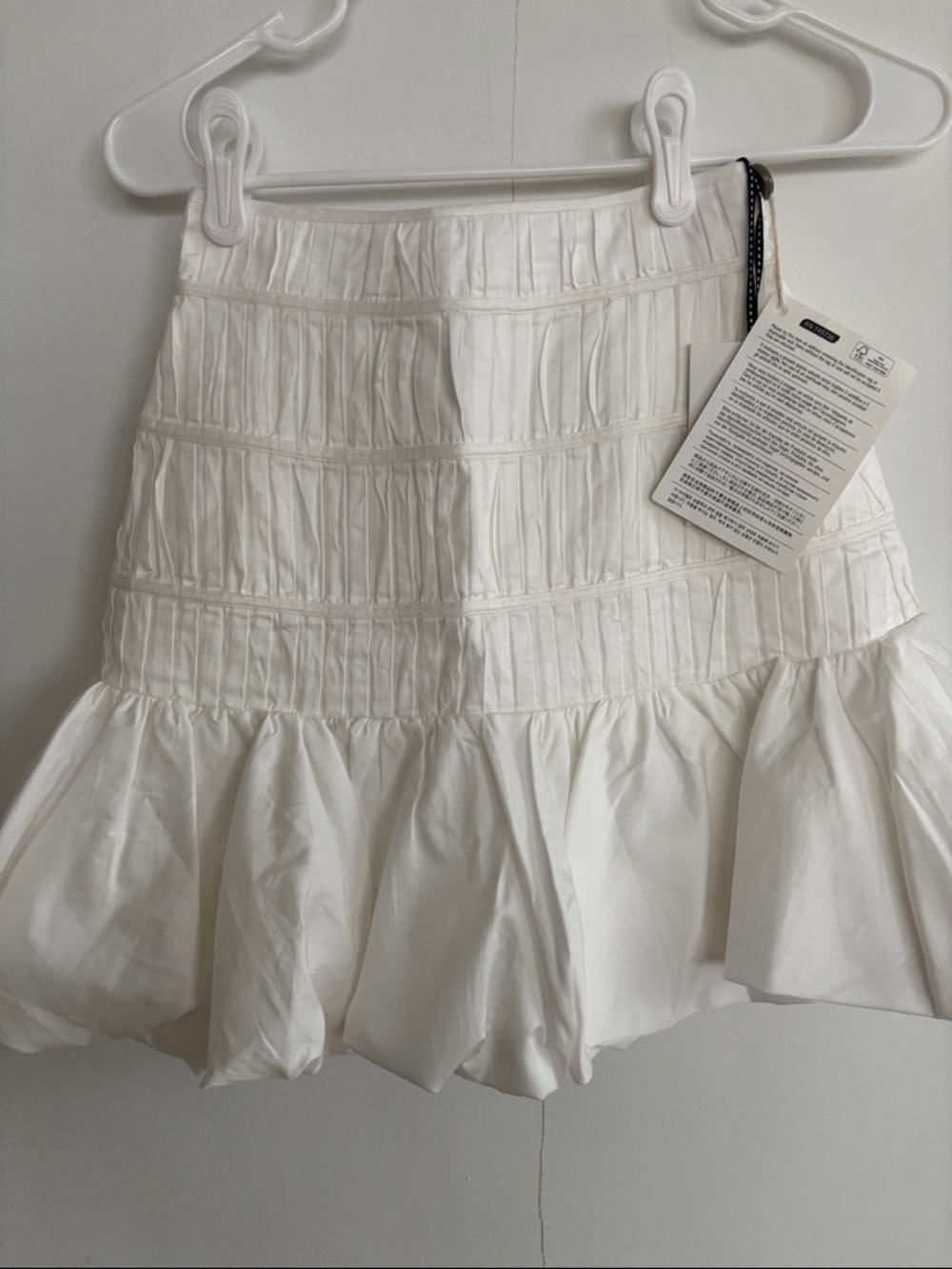 Aje White Smocked Mini Skirt with Ruffle Hem